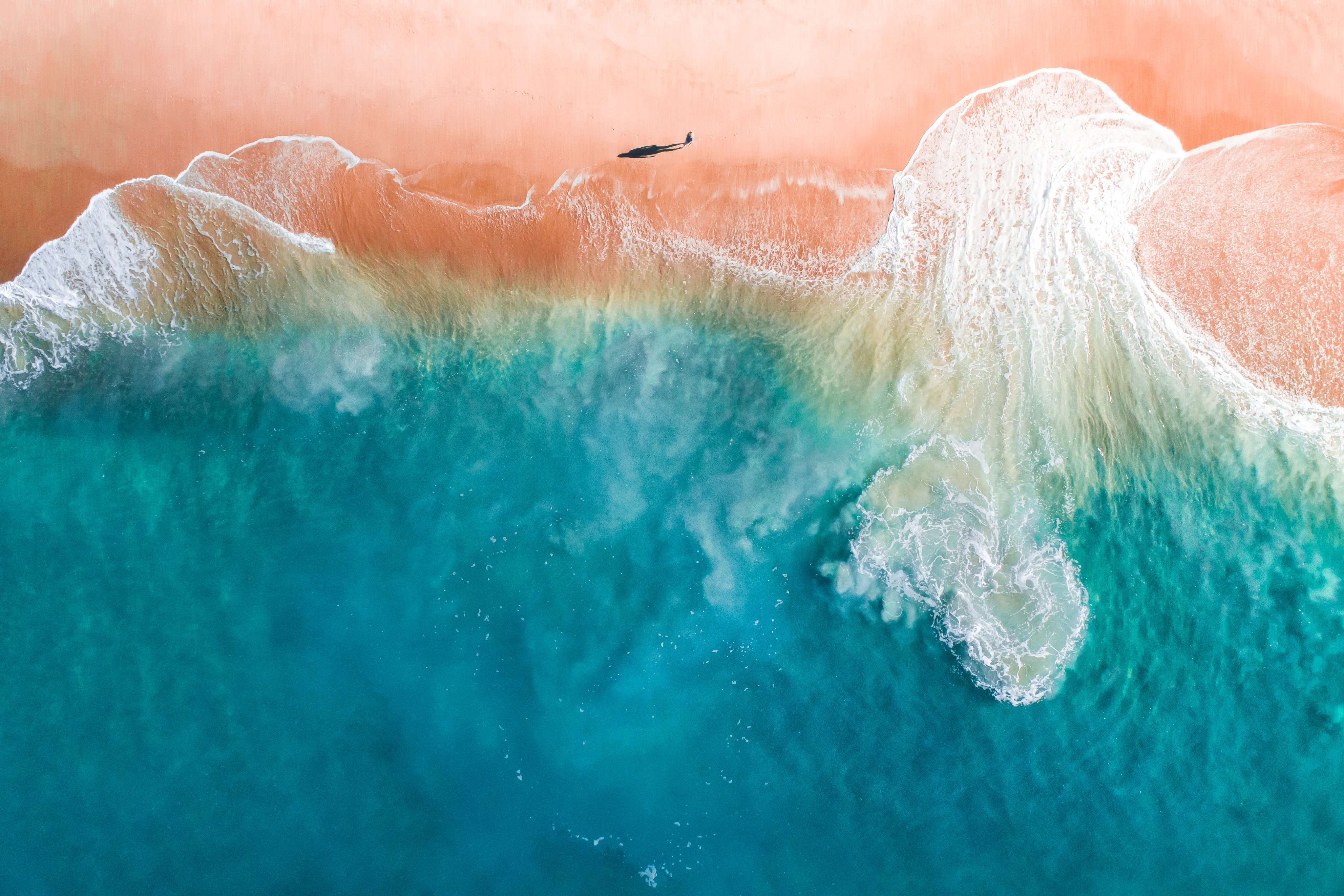 Solo beach walk aerial
